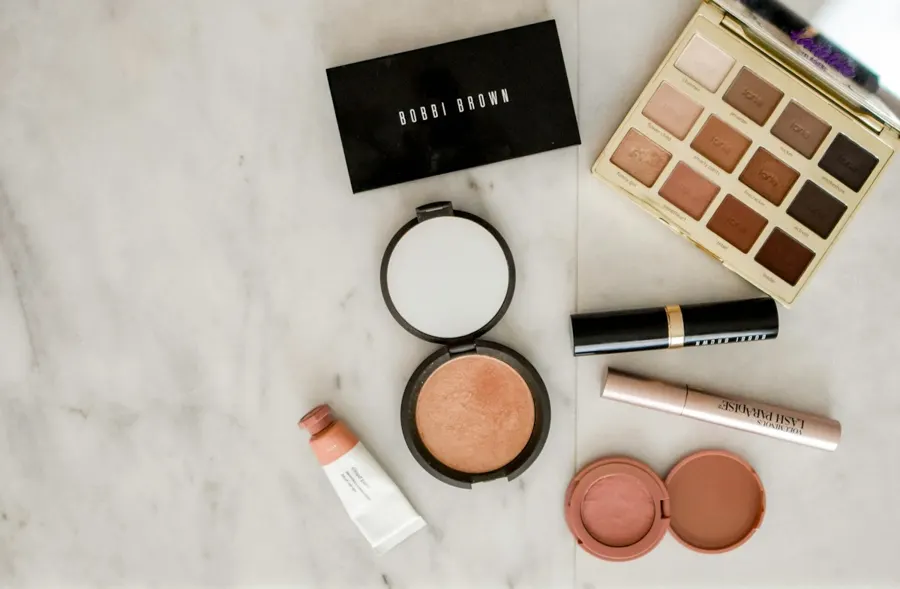 Palette, blush and compact on marble