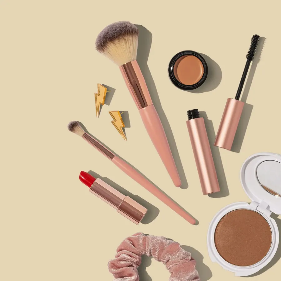 Brushes, blush and lipstick flat lay